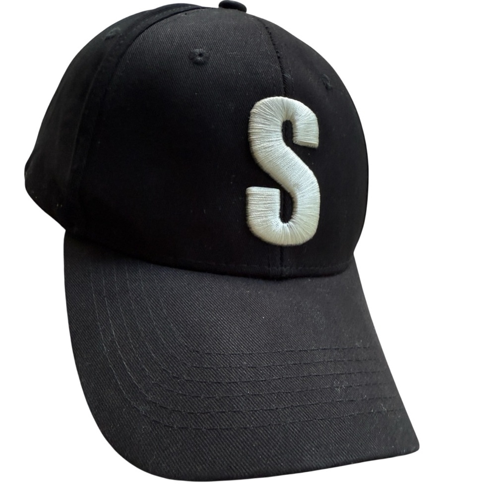 EQC Hotel & Casino Black Cap with White “S” Logo from Melonwear
